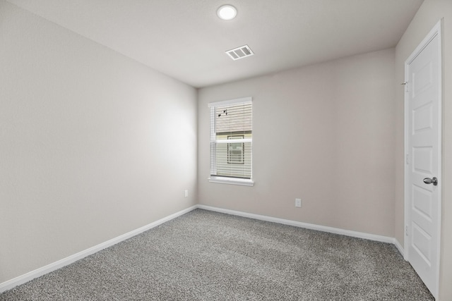 empty room with carpet flooring