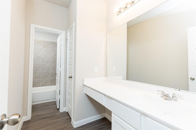 bathroom with shower / tub combo with curtain, vanity, and hardwood / wood-style floors