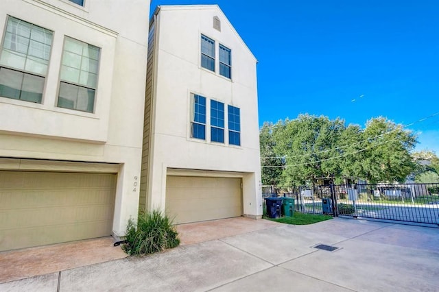 view of side of property with a garage