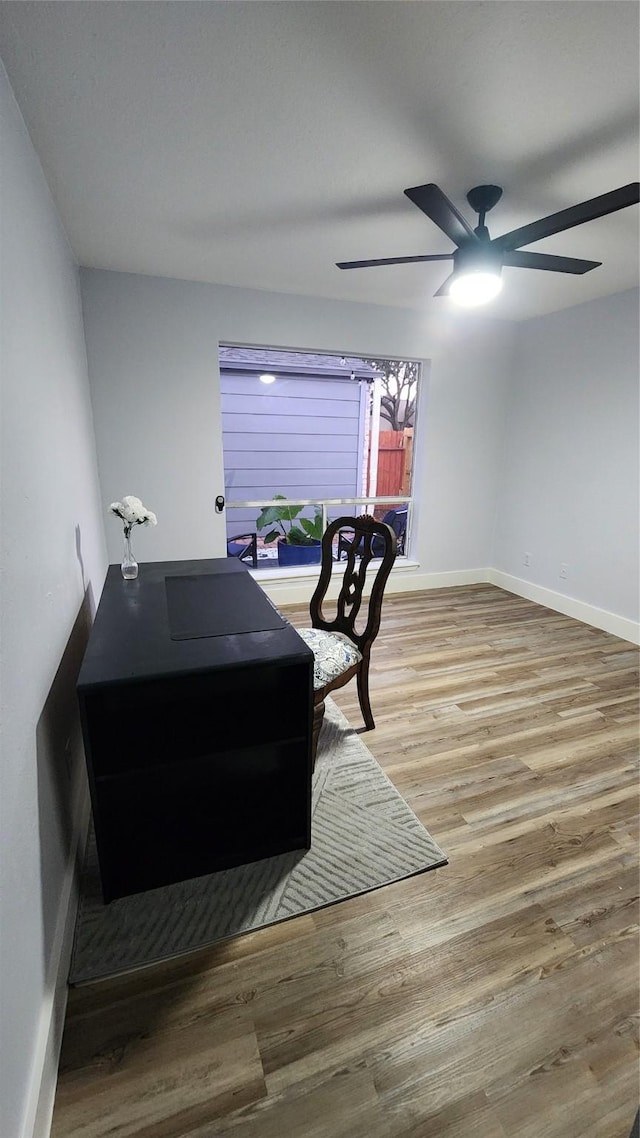 sitting room featuring ceiling fan and wood-type flooring