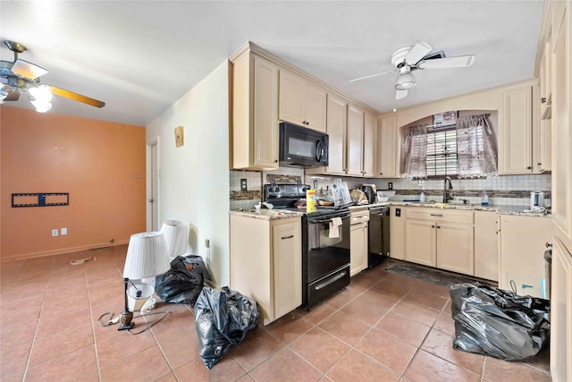 kitchen featuring ceiling fan, sink, cream cabinets, and black appliances