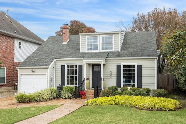 view of front facade featuring a garage and a front yard