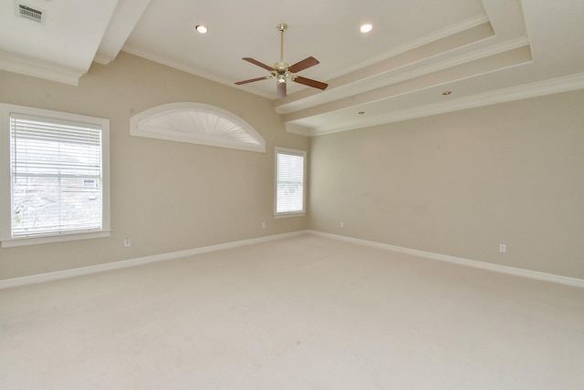 carpeted spare room with crown molding and ceiling fan