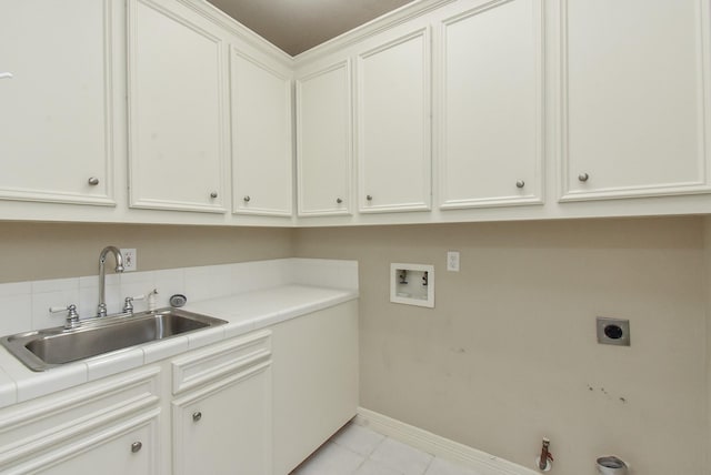 washroom featuring light tile patterned flooring, sink, cabinets, hookup for a washing machine, and electric dryer hookup