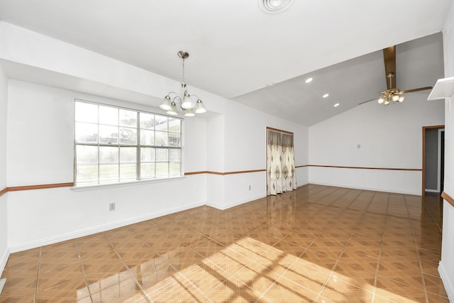 spare room featuring lofted ceiling and a chandelier