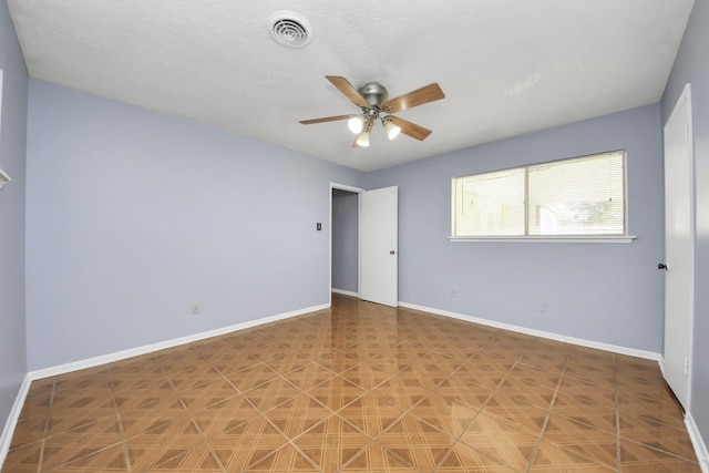 unfurnished room with ceiling fan