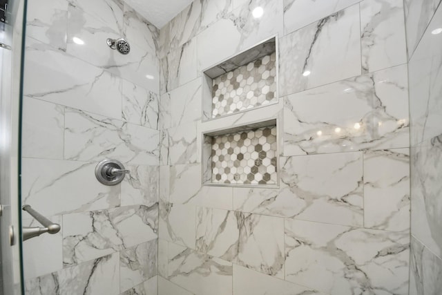 details featuring tiled shower