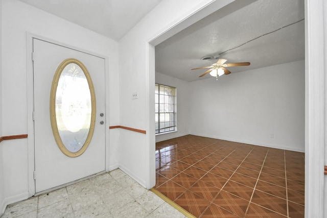 entryway featuring ceiling fan