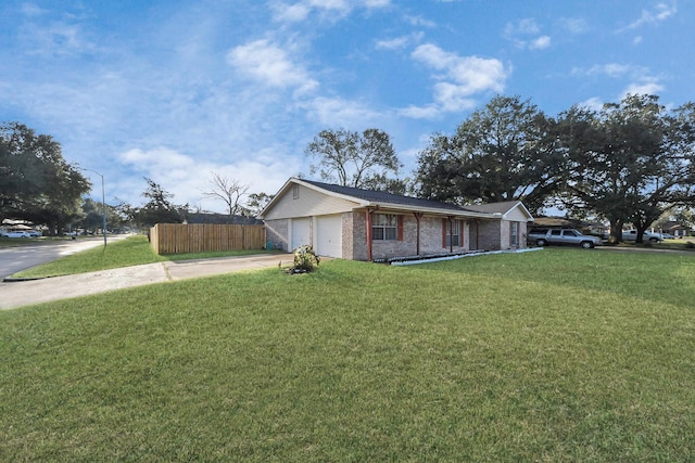 view of front of house with a garage and a front yard