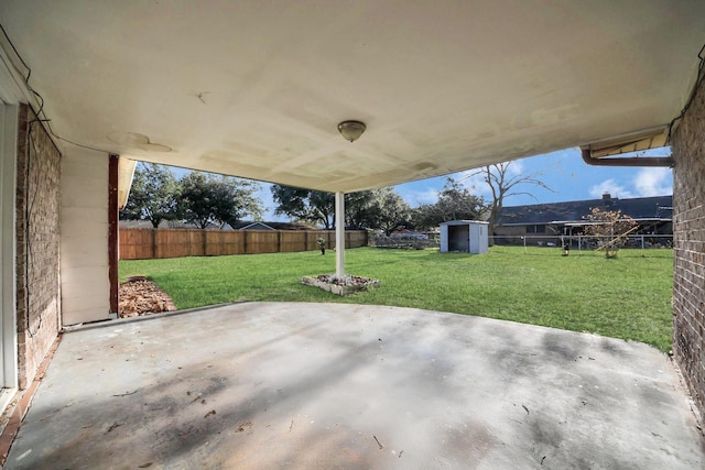 view of patio / terrace featuring a storage unit