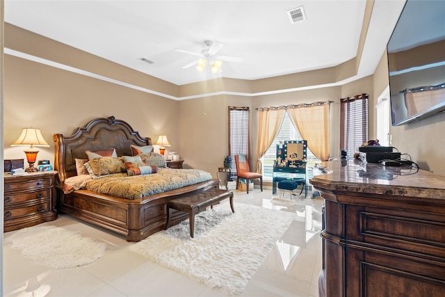 bedroom featuring light tile patterned floors and ceiling fan