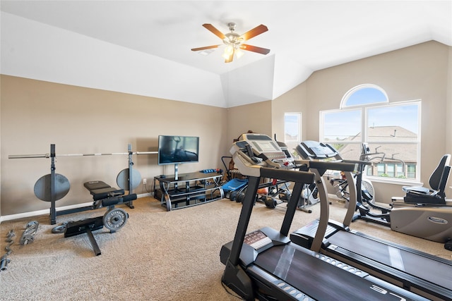 workout room with vaulted ceiling, ceiling fan, and carpet