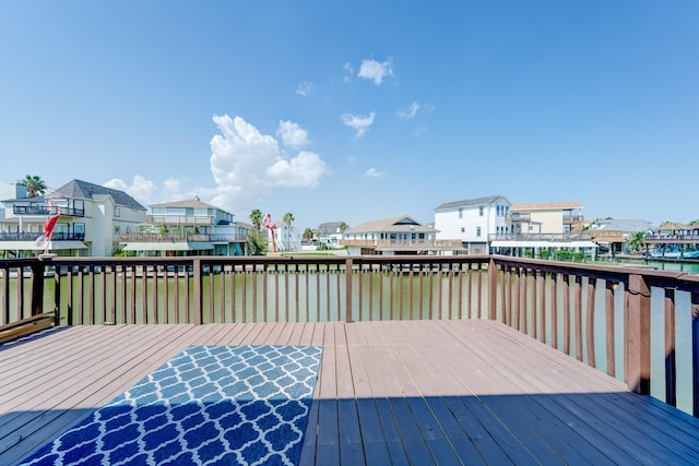 view of dock featuring a deck with water view