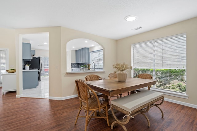 dining room with dark hardwood / wood-style floors