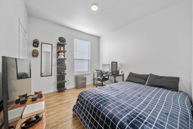 bedroom with wood-type flooring