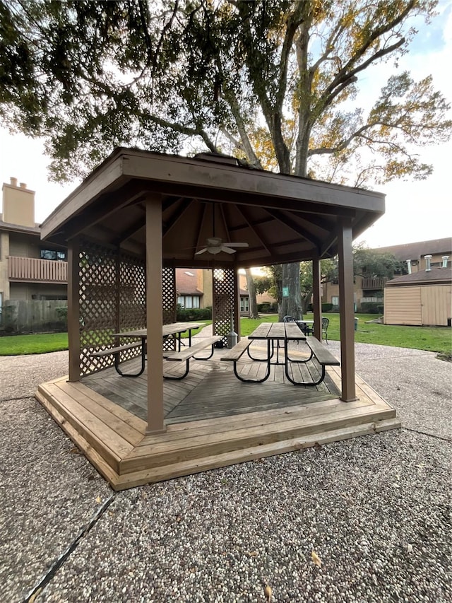 view of community featuring a gazebo and a wooden deck