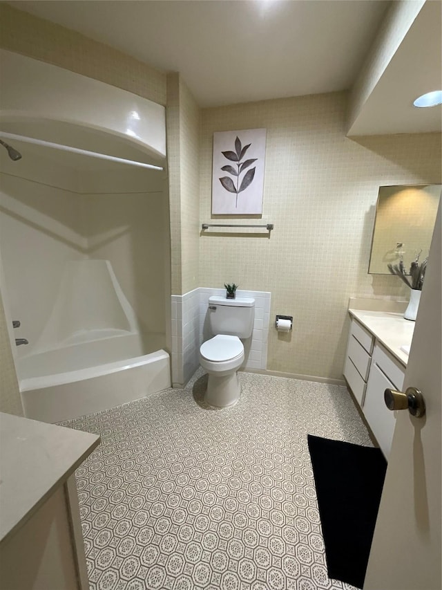 full bathroom with vanity, toilet, and bathing tub / shower combination