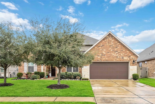 view of front of home featuring a garage and a front lawn