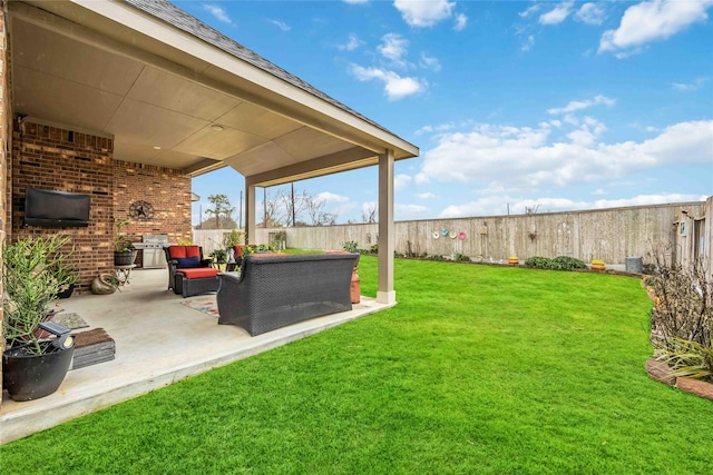 view of yard with an outdoor living space and a patio area