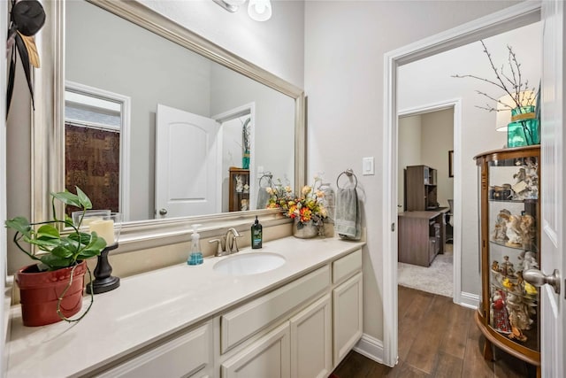 bathroom featuring vanity and hardwood / wood-style floors