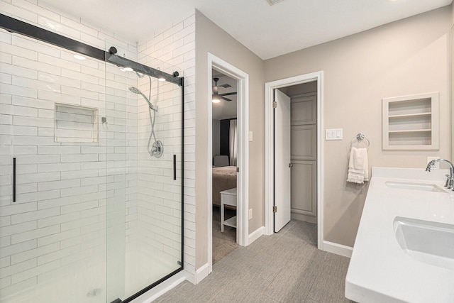 bathroom featuring vanity, ceiling fan, and walk in shower