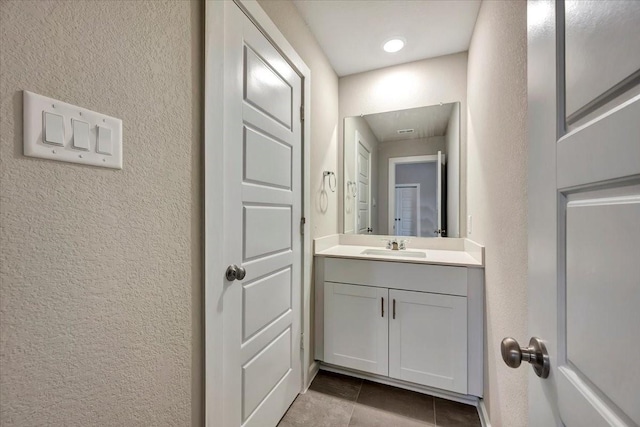 bathroom featuring vanity and tile patterned flooring