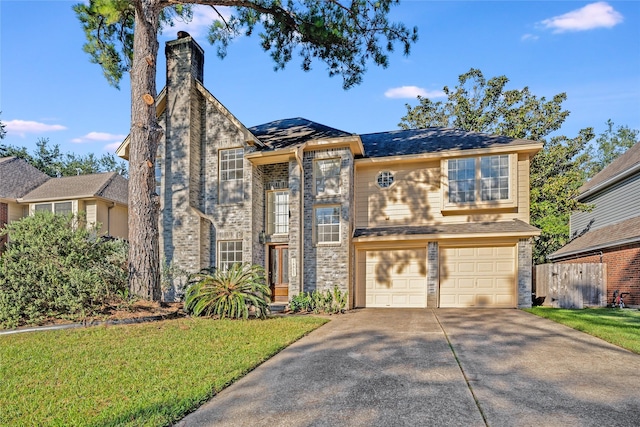 view of front facade featuring a garage and a front yard