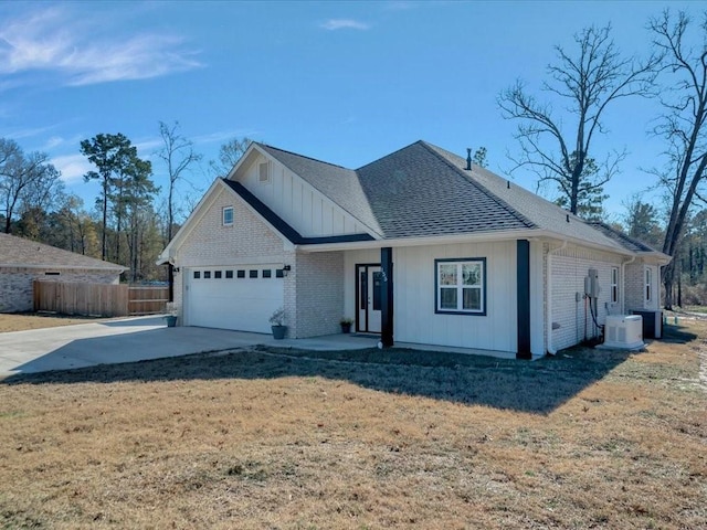 view of front of home with a garage and a front yard