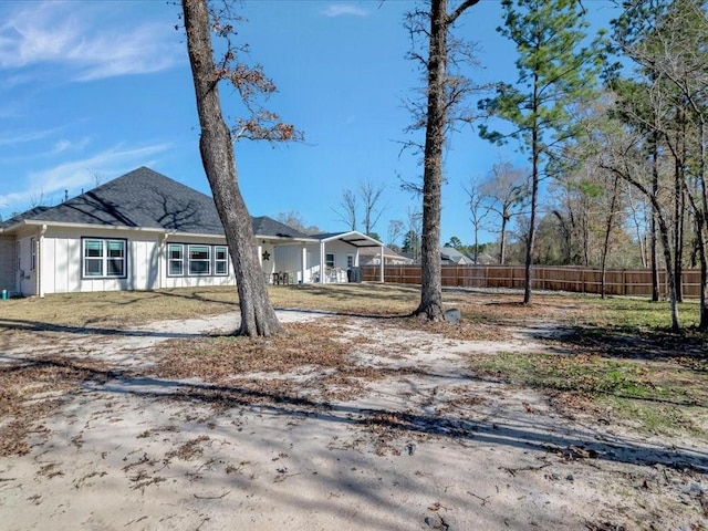 exterior space featuring a carport