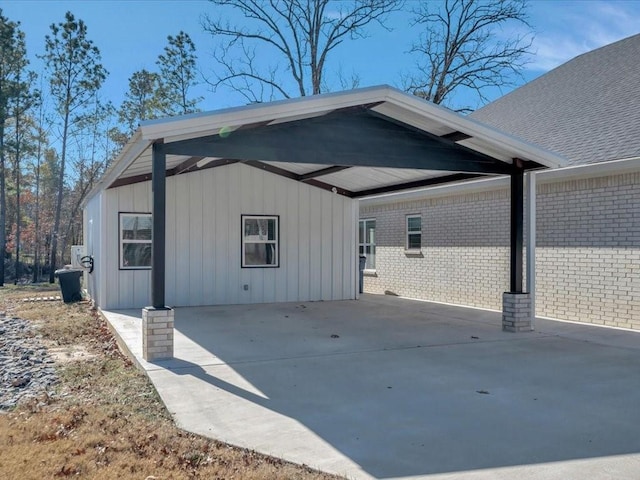 view of side of home with a carport