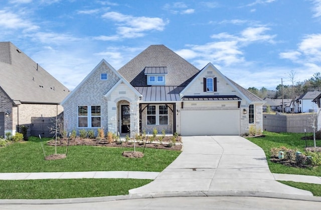 view of front facade with a garage and a front yard