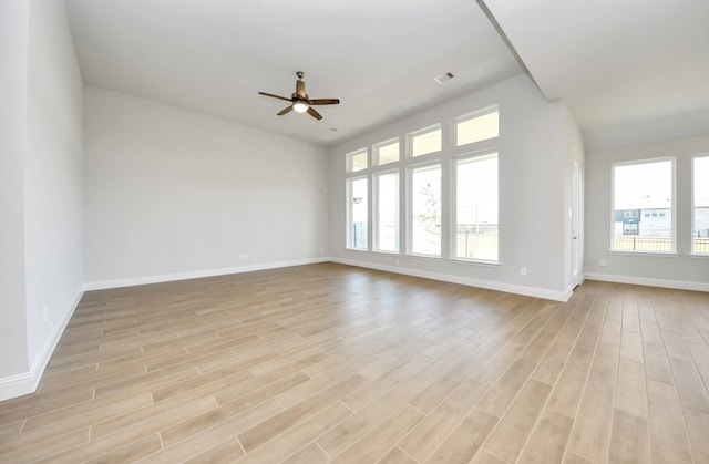 unfurnished room featuring light wood-type flooring and ceiling fan