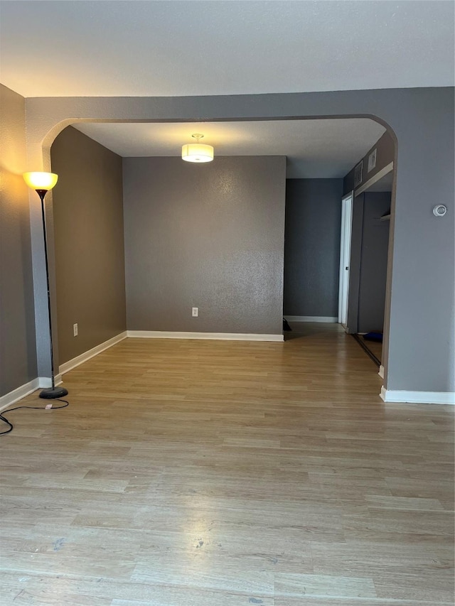 unfurnished room featuring light hardwood / wood-style flooring