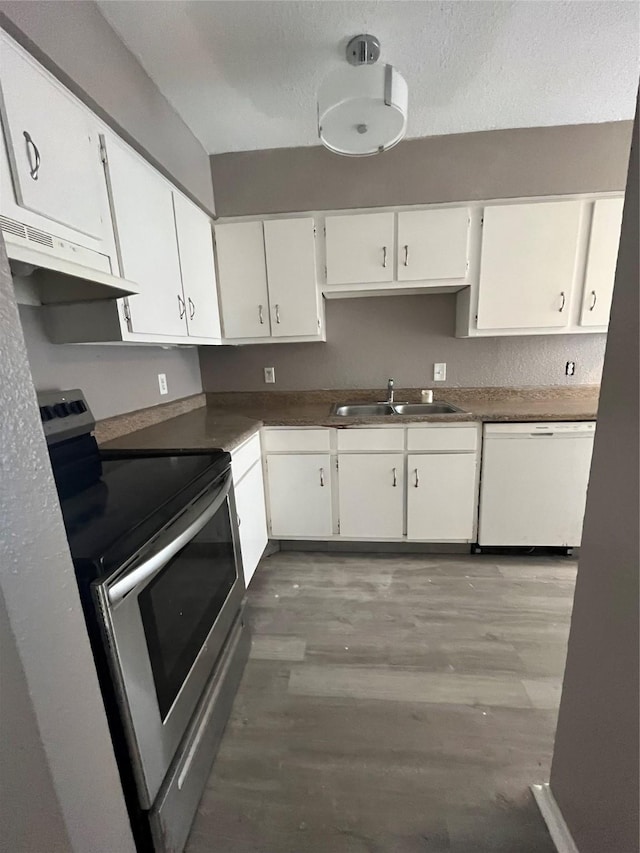 kitchen featuring electric stove, sink, light hardwood / wood-style flooring, white cabinetry, and white dishwasher