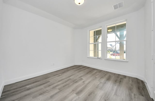 spare room with light hardwood / wood-style floors