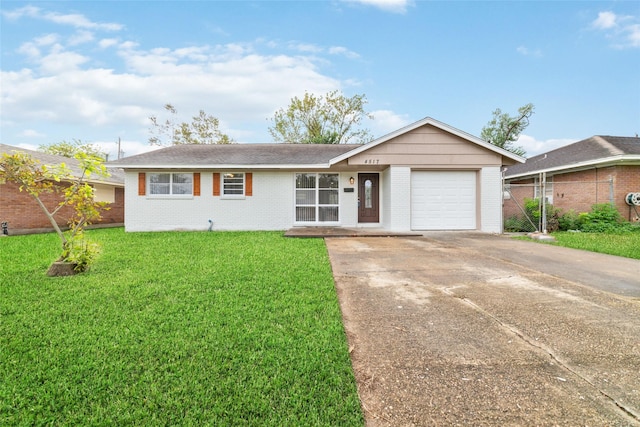 single story home featuring a garage and a front lawn