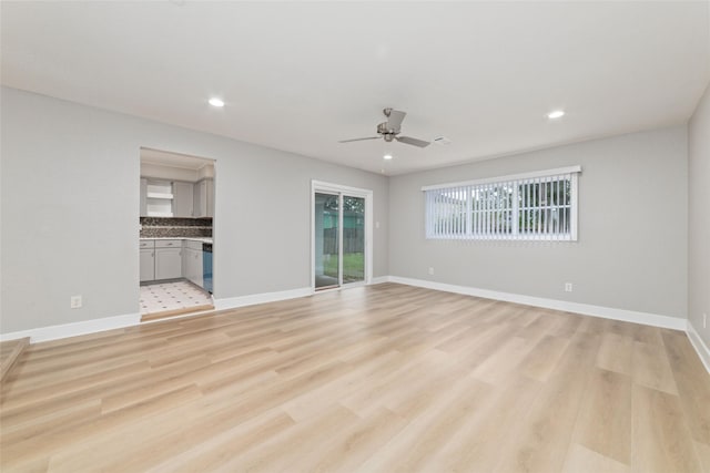 unfurnished living room featuring light hardwood / wood-style floors and ceiling fan