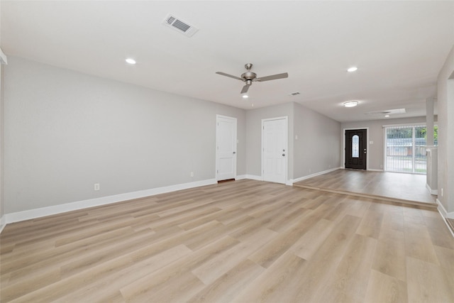 unfurnished living room featuring ceiling fan and light wood-type flooring