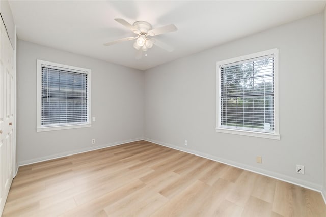 spare room featuring ceiling fan and light wood-type flooring