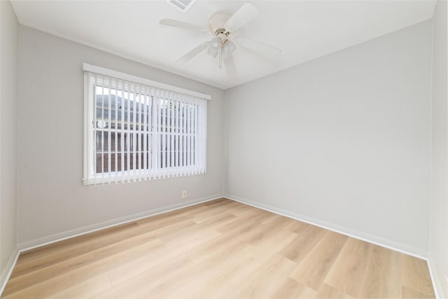 unfurnished room with ceiling fan and light wood-type flooring