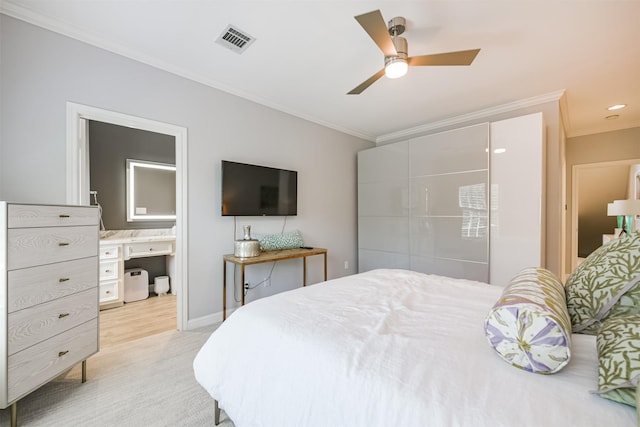 carpeted bedroom featuring ornamental molding, visible vents, ceiling fan, and baseboards