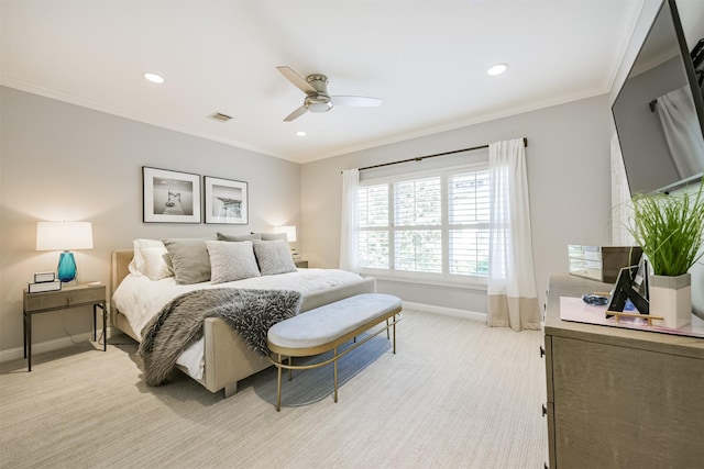 bedroom featuring ornamental molding, light colored carpet, visible vents, and baseboards