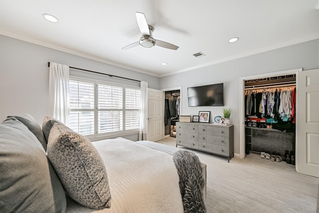 bedroom with ornamental molding, light colored carpet, visible vents, and recessed lighting