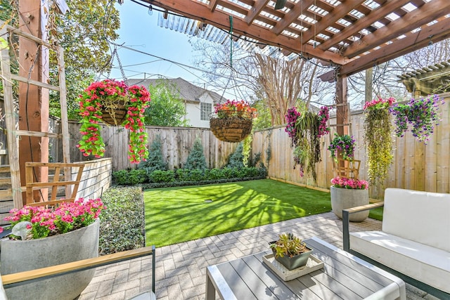 view of yard featuring a patio area, a fenced backyard, and a pergola