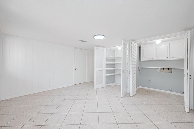 interior space with light tile patterned floors