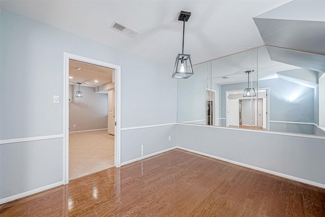 unfurnished dining area with light hardwood / wood-style flooring