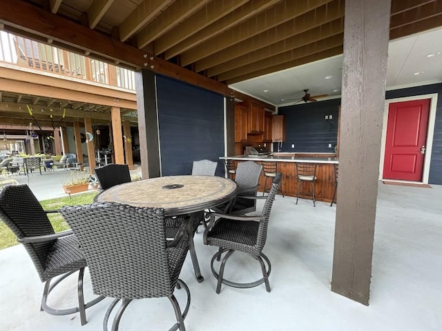 view of patio featuring an outdoor bar