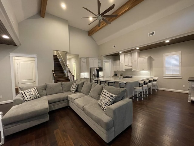 living room with sink, high vaulted ceiling, dark hardwood / wood-style flooring, beamed ceiling, and ceiling fan