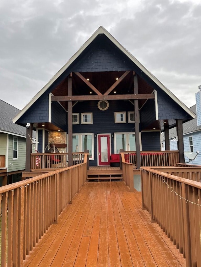 rear view of property with a wooden deck