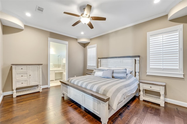 bedroom featuring crown molding, ceiling fan, dark hardwood / wood-style flooring, and ensuite bath